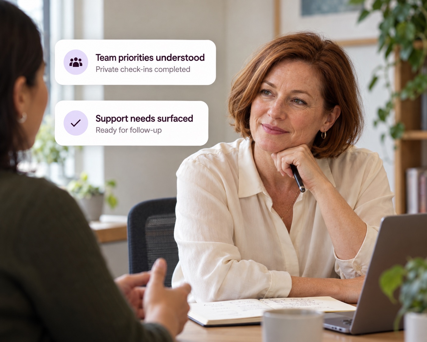 A people leader listening in a one-on-one, with Decided cards showing team priorities understood and support needs surfaced