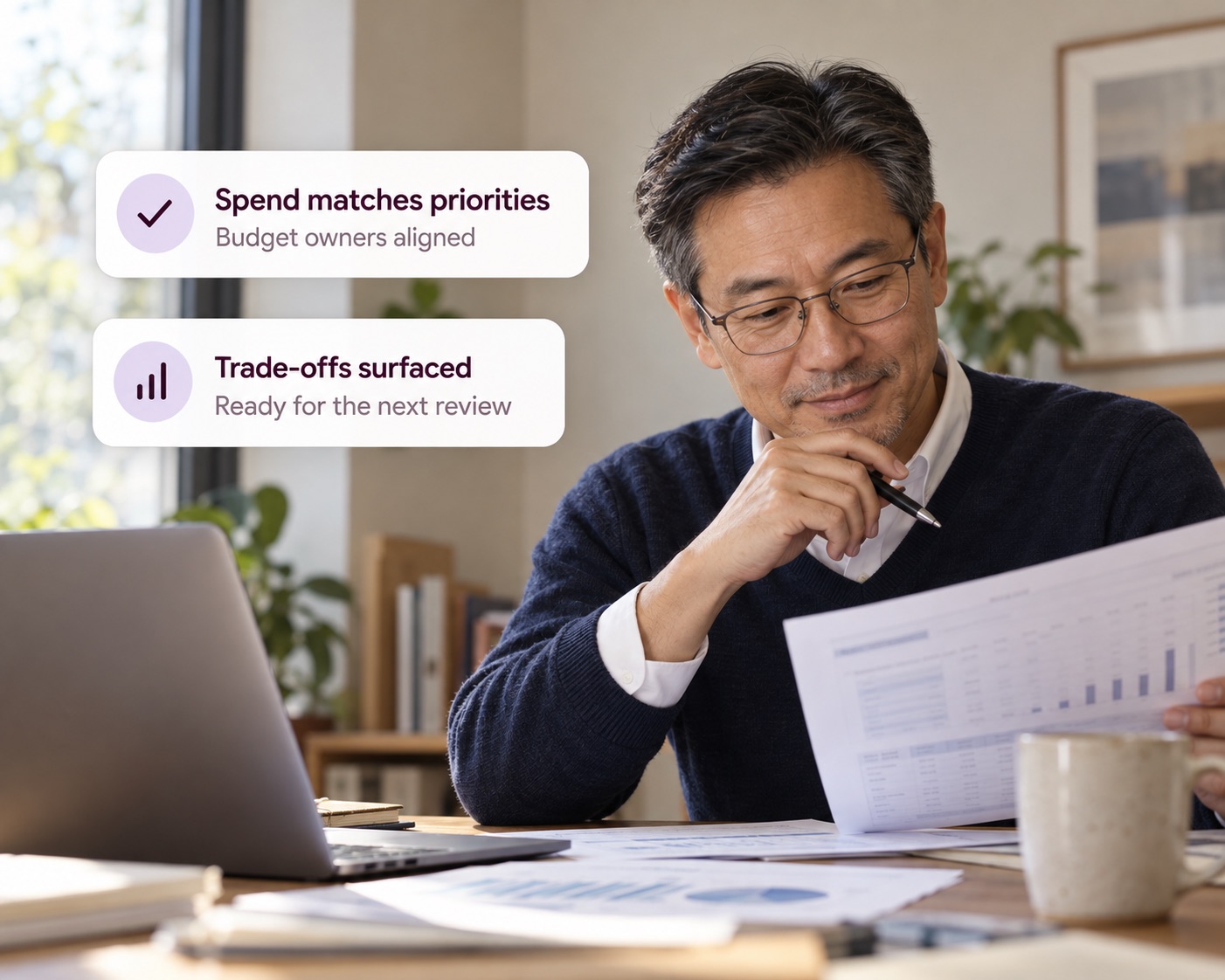 An operating partner reading a report at his desk, with Decided cards showing spend matching priorities and trade-offs surfaced